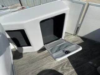 Slide: The Image of 2023 Sweetwater 2086C boat storage compartment with open hatch. - 6