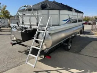 Slide: The Image of 2023 Sweetwater 2086C pontoon boat on trailer with ladder, rear view. - 7