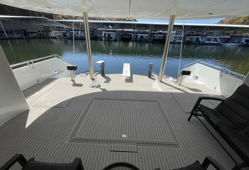 Slide: The Image of Spacious deck of 2009 Sumerset Amy Chris houseboat docked at marina. - 13