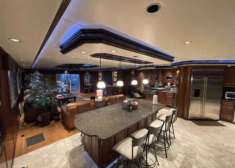 Slide: The Image of Luxurious 2009 Sumerset houseboat interior with modern kitchen and seating area. - 16