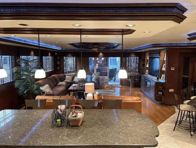 Slide: The Image of Luxurious interior of a 2009 Sumerset houseboat, featuring a spacious living area and modern kitchen. - 20