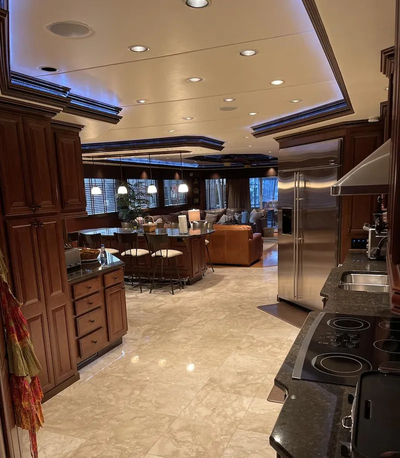 Slide: The Image of Luxurious interior of a 2009 Sumerset 23' x 118' houseboat with modern kitchen and living area. - 21