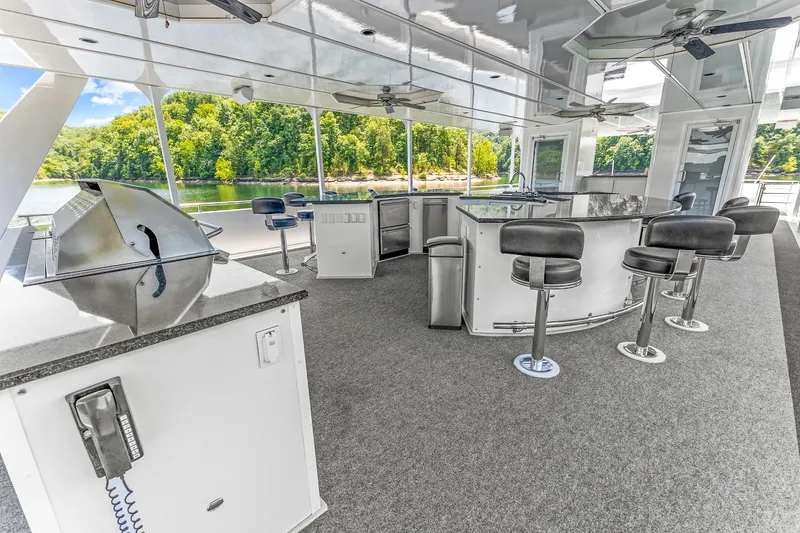 Slide: The Image of Luxurious 2009 Sumerset houseboat interior with bar, seating, and scenic river view. - 32