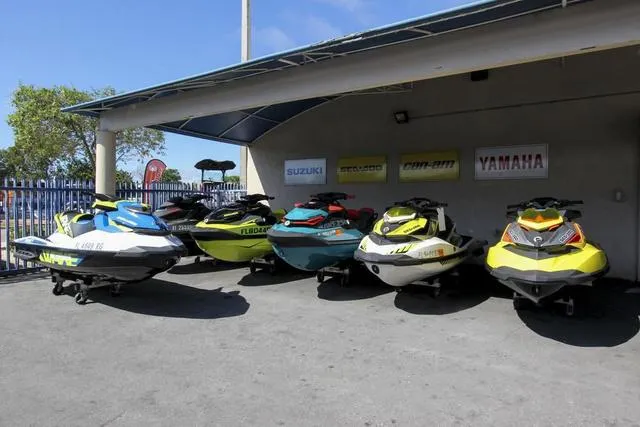 Slide: The Image of Lineup of 2023 Yamaha Waverunner Superjet® and other jet skis at dealership. - 10