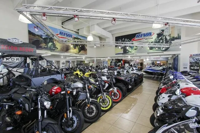 Slide: The Image of Showroom displaying 2023 Yamaha Waverunners Waverunner Superjet® and various motorcycles. - 19