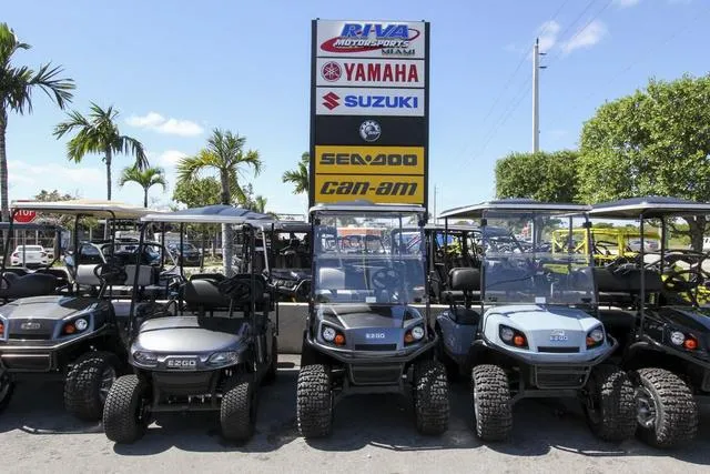Slide: The Image of 2023 Yamaha Waverunners Superjet® displayed at Riva Motorsports with golf carts and brand signs. - 21