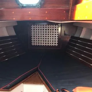 Slide: The Image of Interior cabin of a 1958 Custom Larson 40 boat with wooden finishes. - 11