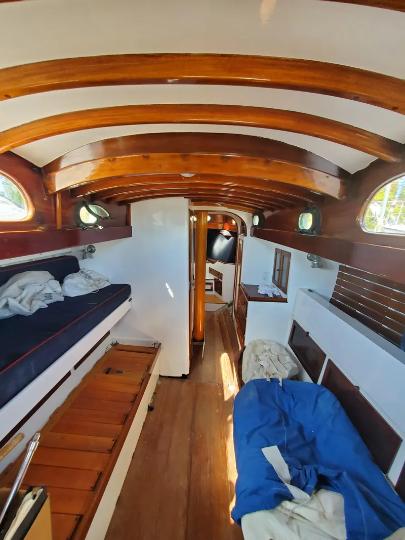 Slide: The Image of Interior of 1958 Custom Larson 40 boat with wooden beams and cozy seating. - 6