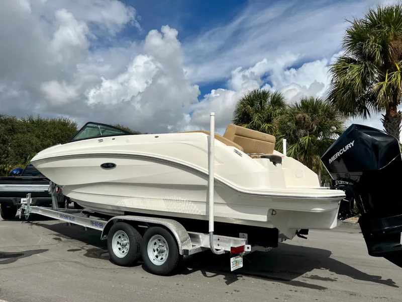 Slide: The Image of 2020 Sea Ray SDX 250 boat on a trailer with Mercury outboard motor. - 18