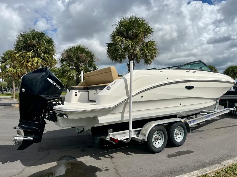 Slide: The Image of 2020 Sea Ray SDX 250 boat on trailer with Mercury outboard motor. - 2