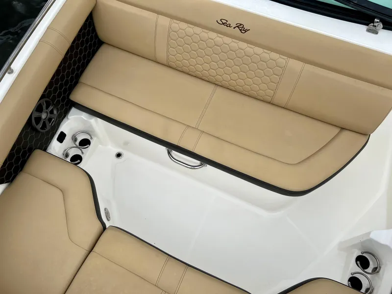 Slide: The Image of 2020 Sea Ray SDX 250 boat interior with beige leather seating. - 24