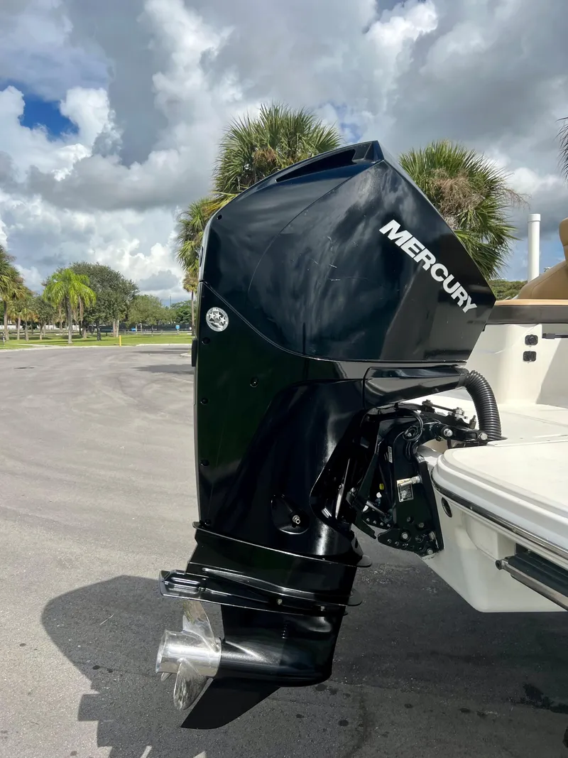 Slide: The Image of 2020 Sea Ray SDX 250 with Mercury outboard motor in a scenic outdoor setting. - 7