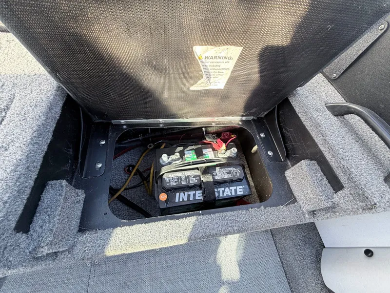 Slide: The Image of Battery compartment of a 2022 Alumacraft Edge 175 Sport boat. - 10