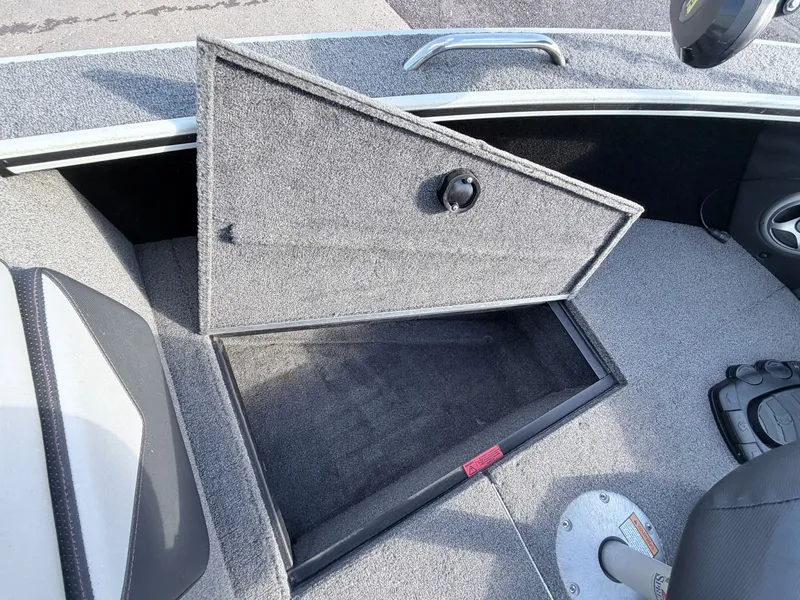 Slide: The Image of 2022 Alumacraft Edge 175 Sport, open storage compartment in boat. - 17