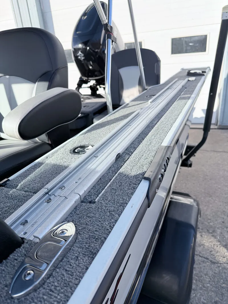 Slide: The Image of 2022 Alumacraft Edge 175 Sport boat interior with gray carpeting. - 27