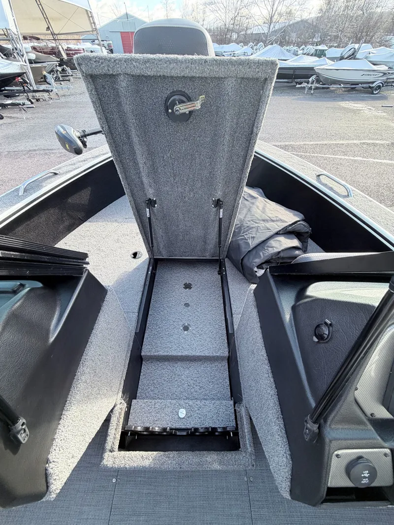 Slide: The Image of 2022 Alumacraft Edge 175 Sport boat with open storage compartment. - 30