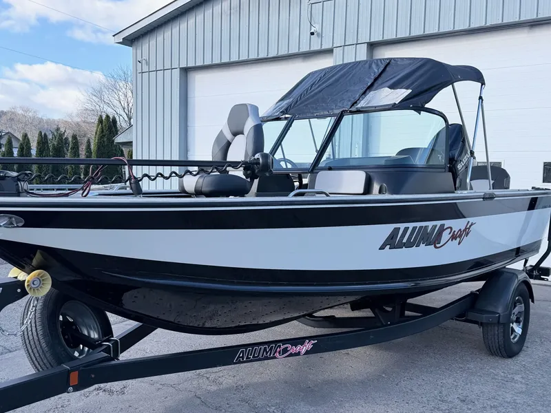 Slide: The Image of 2022 Alumacraft Edge 175 Sport boat parked by garage. - 46