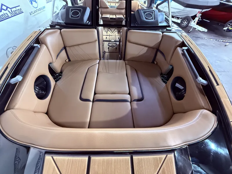 Slide: The Image of Interior of 2023 Supra SA 550 boat with luxurious leather seating. - 11