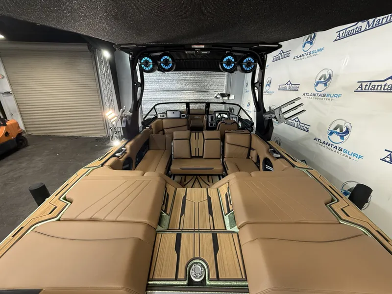 Slide: The Image of Interior of 2023 Supra SA 550 boat with luxurious seating. - 19