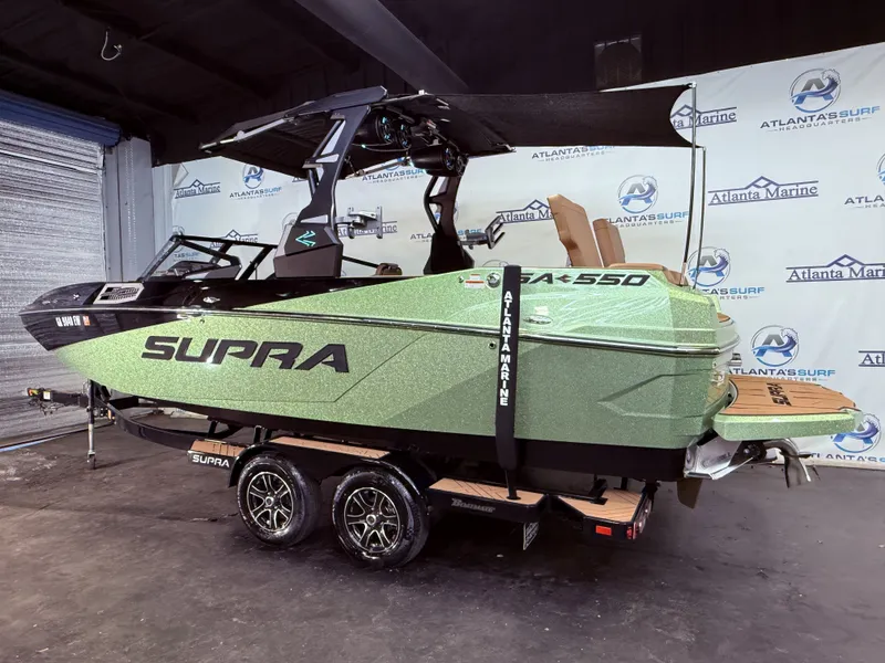 Slide: The Image of 2023 Supra SA 550 boat in green design at Atlanta Marine. - 3