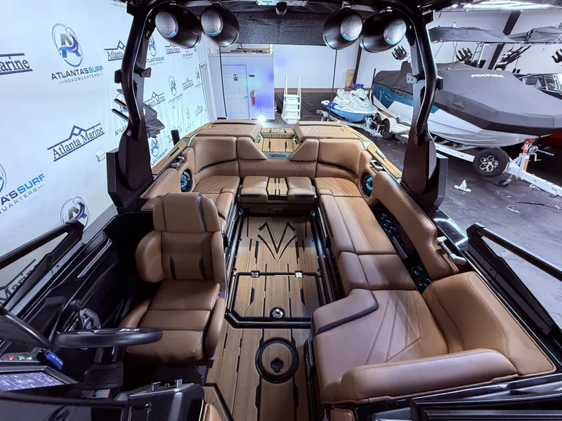Slide: The Image of Interior of 2023 Supra SA 550 boat with luxurious seating. - 30