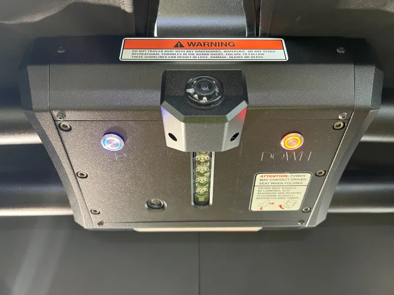 Slide: The Image of 2023 Supra SA 550 boat tower control with warning labels. - 37