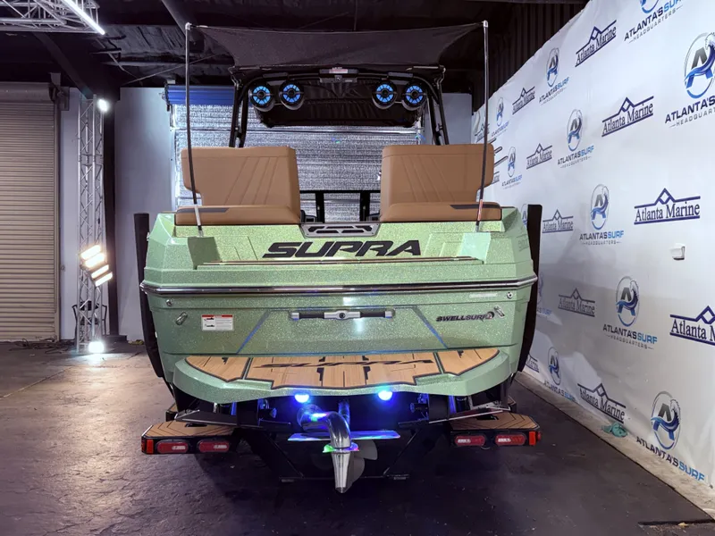 Slide: The Image of Rear view of 2023 Supra SA 550 boat in a showroom. - 5