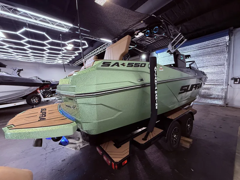 Slide: The Image of 2023 Supra SA 550 boat in a modern garage. - 8