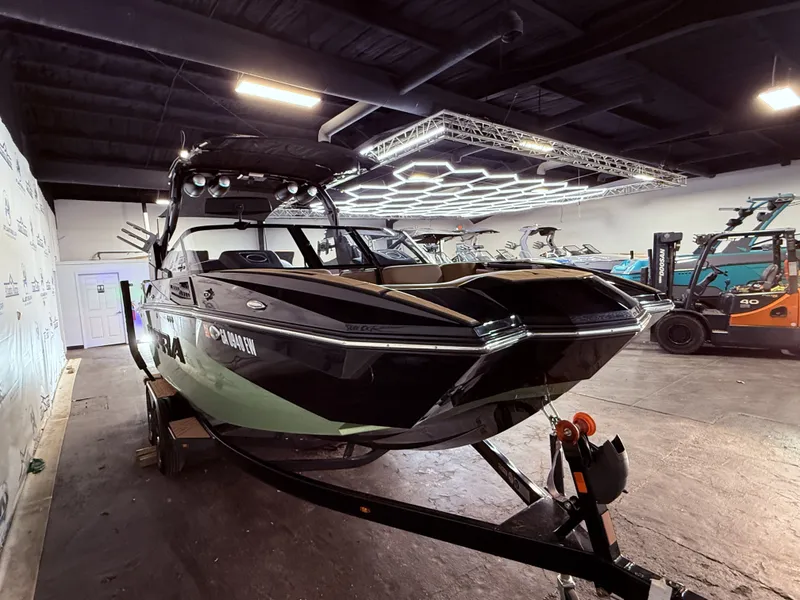 Slide: The Image of 2023 Supra SA 550 boat in a warehouse setting. - 9