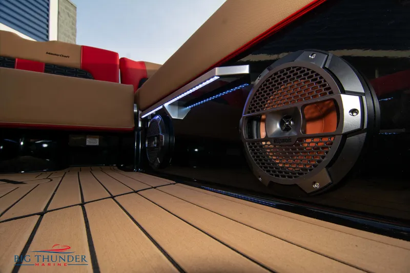 Slide: The Image of 2021 MasterCraft X24 boat interior with premium sound system and teak flooring. - 22