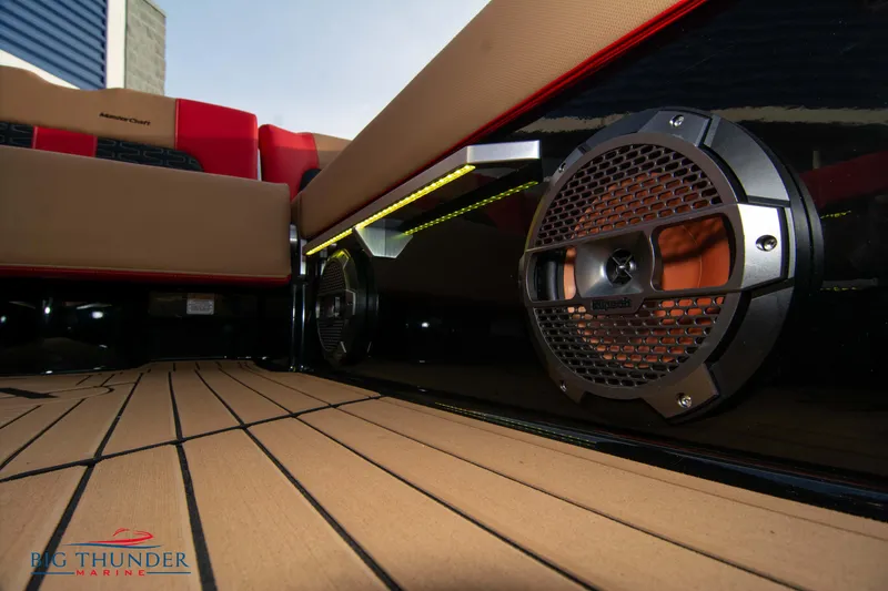 Slide: The Image of 2021 MasterCraft X24 boat interior with premium sound system and teak flooring. - 23