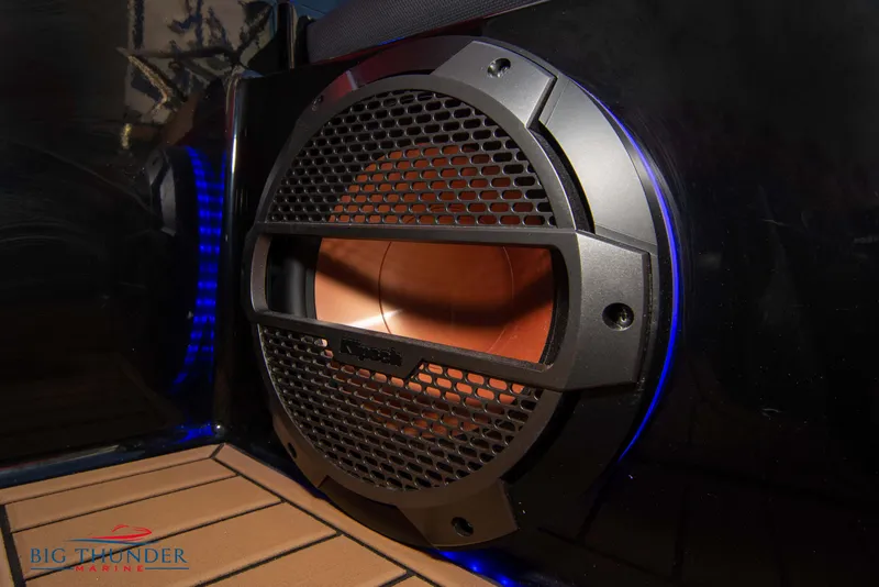 Slide: The Image of Close-up of a 2021 MasterCraft X24 boat speaker with blue LED lighting. - 36