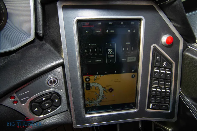 Slide: The Image of 2021 MasterCraft X24 boat dashboard with touchscreen controls and navigation system. - 44