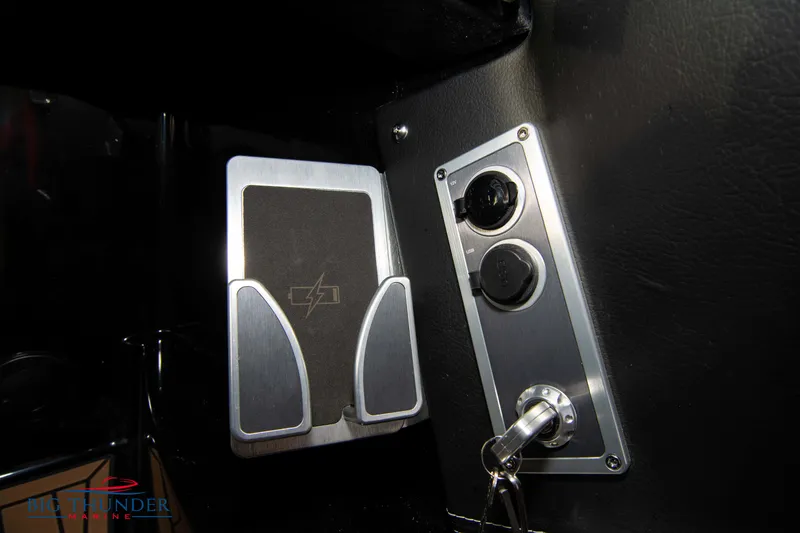 Slide: The Image of MasterCraft X24 2021 dashboard with key ignition and control panel. - 45