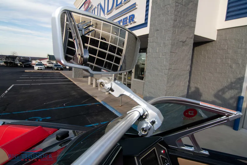 Slide: The Image of 2021 MasterCraft X24 boat mirror and windshield detail at dealership. - 47