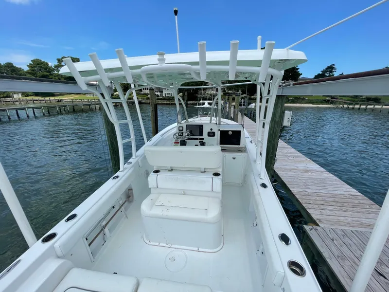 Slide: The Image of 2015 Sea Hunt Edge 24 boat docked at a marina, interior view. - 3