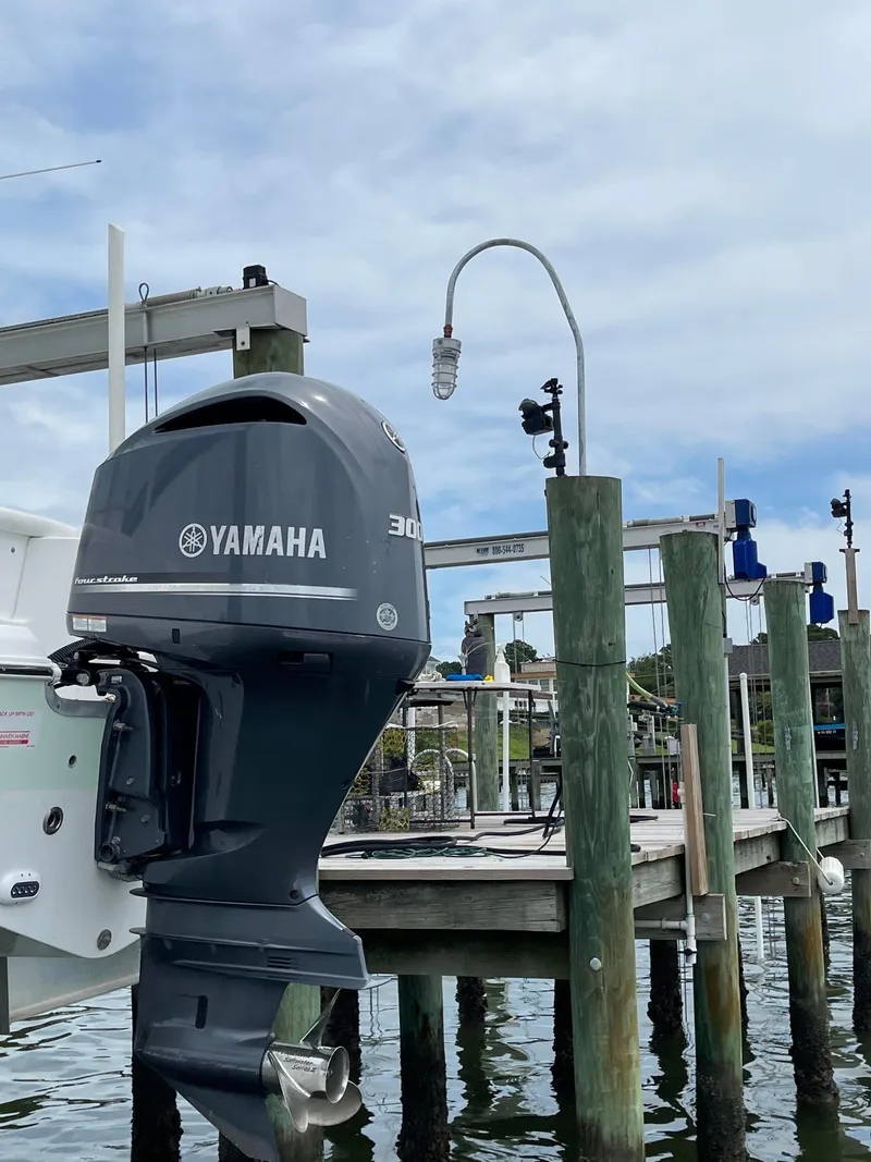 Slide: The Image of 2015 Sea Hunt Edge 24 with Yamaha 300 outboard motor docked. - 6