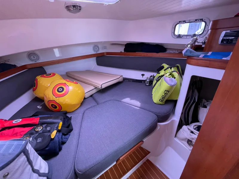 Slide: The Image of 2004 Hunt Yachts Surfhunter 29 bathroom with sink, toilet, and wooden cabinetry. - 13