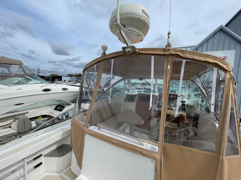 Slide: The Image of 2004 Hunt Yachts Surfhunter 29 deck with seating and nautical accessories. - 8