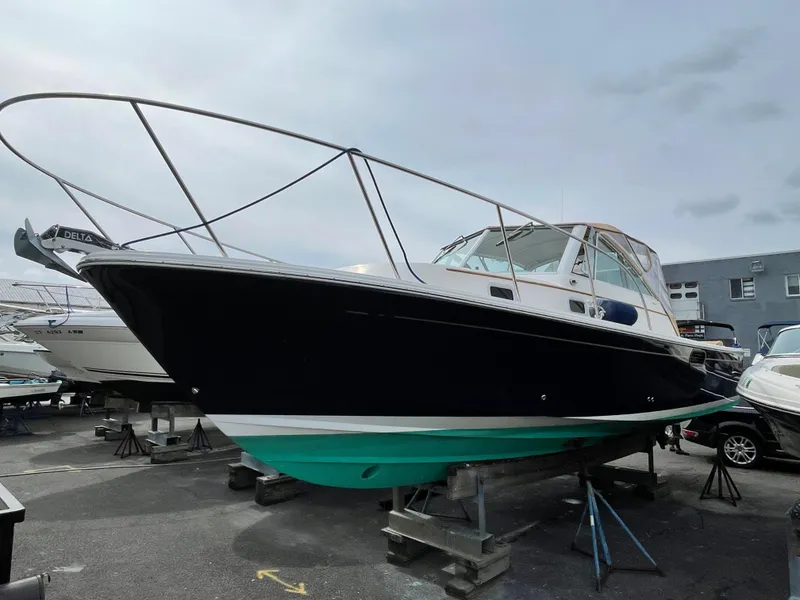 Slide: The Image of 2004 Hunt Yachts Surfhunter 29 on stands, showcasing sleek design and sturdy build. - 0