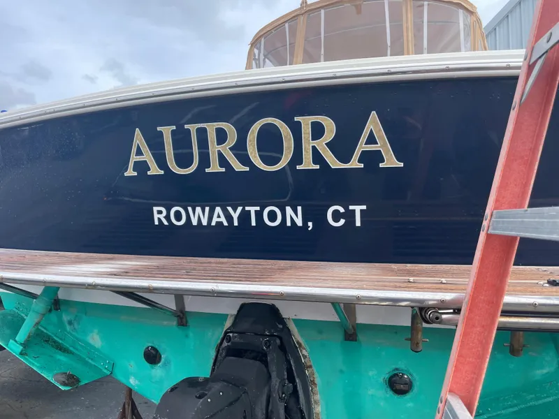 Slide: The Image of 2004 Hunt Yachts Surfhunter 29 named "Aurora" in Rowayton, CT, docked with visible ladder. - 1