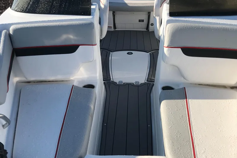 Slide: The Image of Interior seating of 2023 Tahoe 210 Si Limited boat with gray and white upholstery. - 2