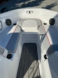 Slide: The Image of 2023 Tahoe 210 Si Limited boat interior with cushioned seating and speakers. - 8