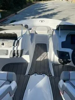 Slide: The Image of 2023 Tahoe 210 Si Limited boat interior with sleek seating and modern dashboard. - 9