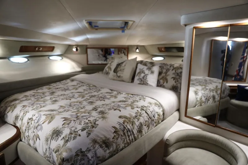 Slide: The Image of Luxurious bedroom interior of 1993 Sea Ray Sundancer yacht with floral bedding. - 20