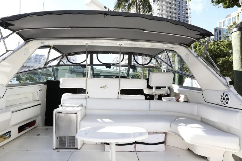 Slide: The Image of 1993 Sea Ray Sundancer yacht interior with white seating and canopy. - 27
