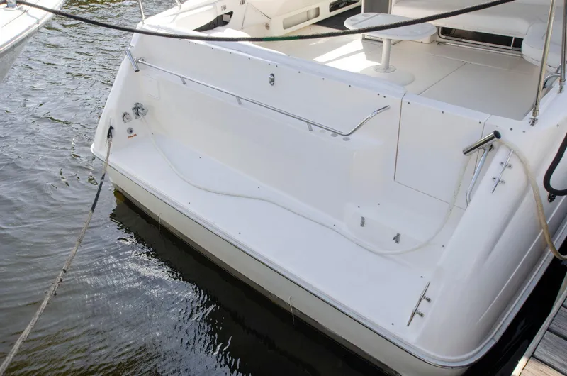 Slide: The Image of 1993 Sea Ray Sundancer boat stern view at dock. - 4