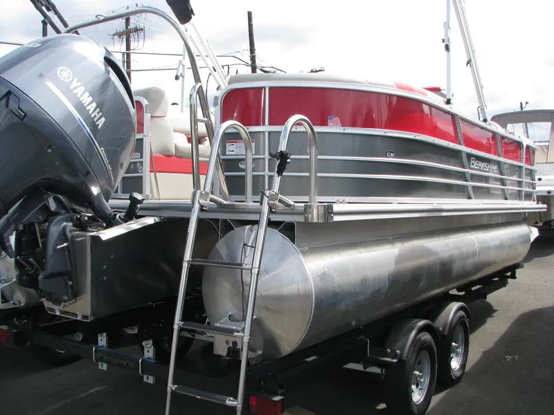 Slide: The Image of 2023 Berkshire 22RFX LE pontoon boat with Yamaha engine on trailer. - 2