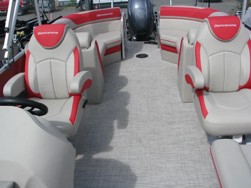 Slide: The Image of 2023 Berkshire 22RFX LE pontoon boat interior with beige and red seating. - 5