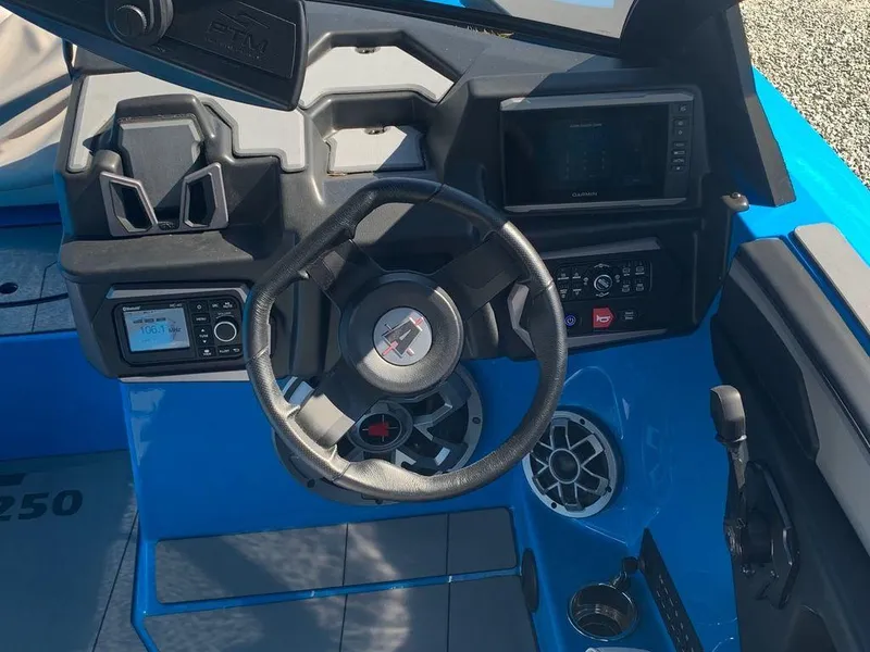 Slide: The Image of 2023 Axis T250 boat dashboard with steering wheel and control panel. - 11